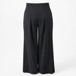 Elegant black wide-leg trousers with high waist, soft front pleats and tailored silhouette on light grey studio background – BIBI SAKALIEVA