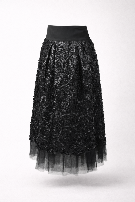 Black faux leather midi skirt with embroidered rose texture and layered crystal tulle on light grey studio background – BIBI SAKALIEVA