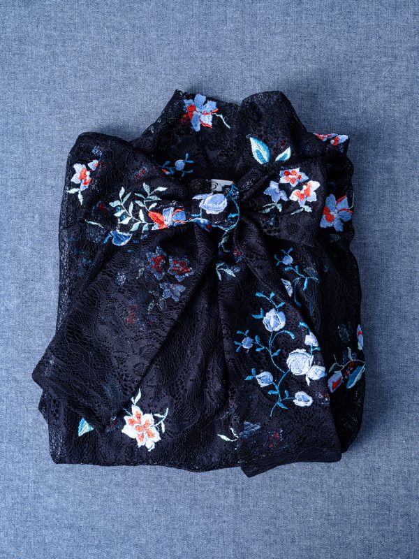 Black lace top with bow detail – romantic bell sleeve design