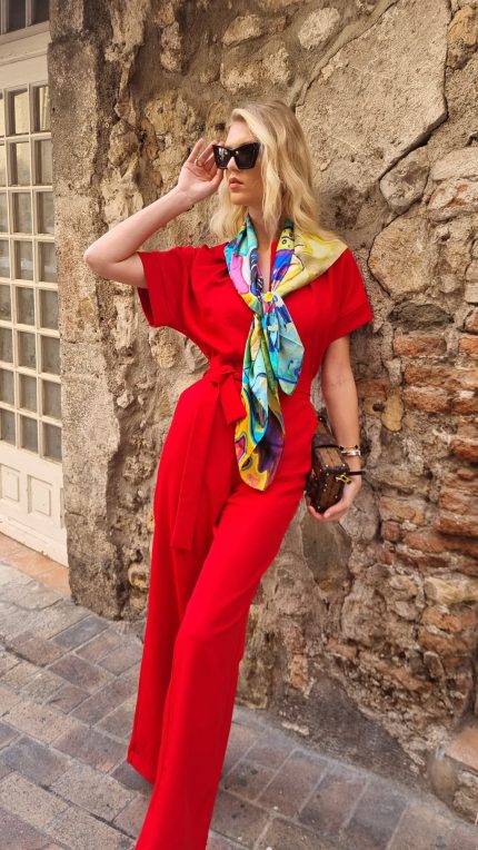 Bold red jumpsuit for women with wide-leg silhouette and waist belt – handmade by BIBI SAKALIEVA.