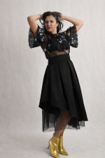 Asymmetrical black satin midi skirt with symmetrical tulle underlayer, modern feminine design by BIBI SAKALIEVA