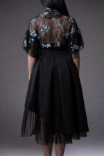 Asymmetrical black satin midi skirt with symmetrical tulle underlayer, modern feminine design by BIBI SAKALIEVA