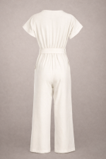 Back view of off-white wide-leg jumpsuit for women with fluid silhouette and tailored waist, minimalist luxury design.