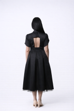Black midi dress with open back and detachable tulle skirt, back view