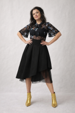 Asymmetrical black satin midi skirt with symmetrical tulle underlayer, modern feminine design by BIBI SAKALIEVA