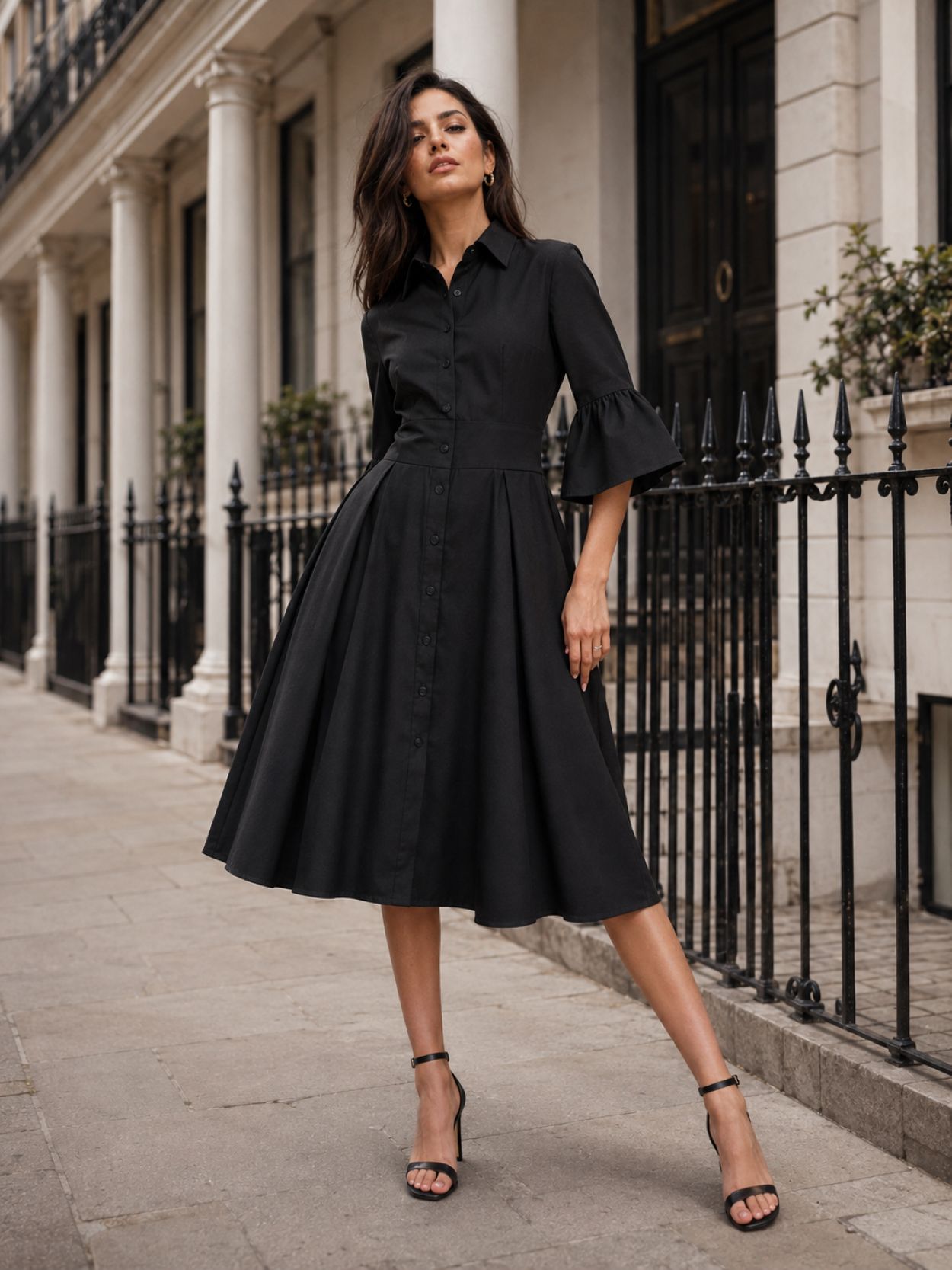Women’s black open back midi dress with soft bell sleeves